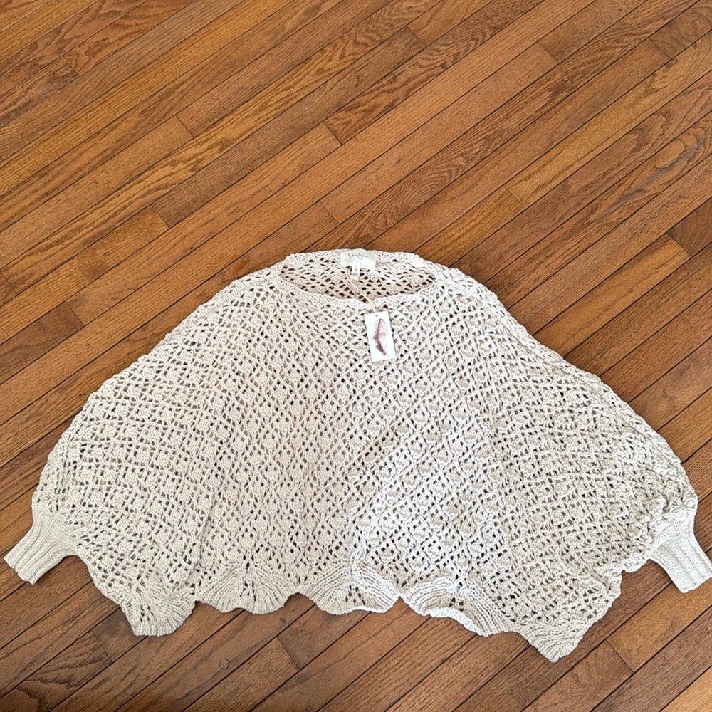 Tan lose fitted Knitted shrug. Brand new with tag.